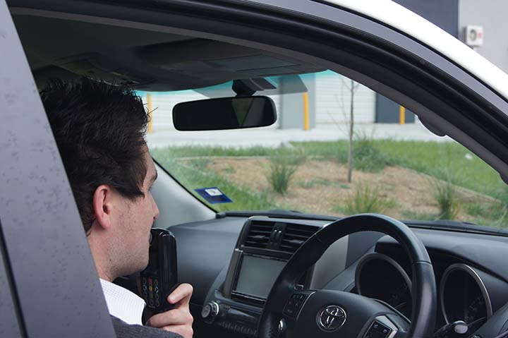 Driver blowing into a Smart Start alcohol interlock